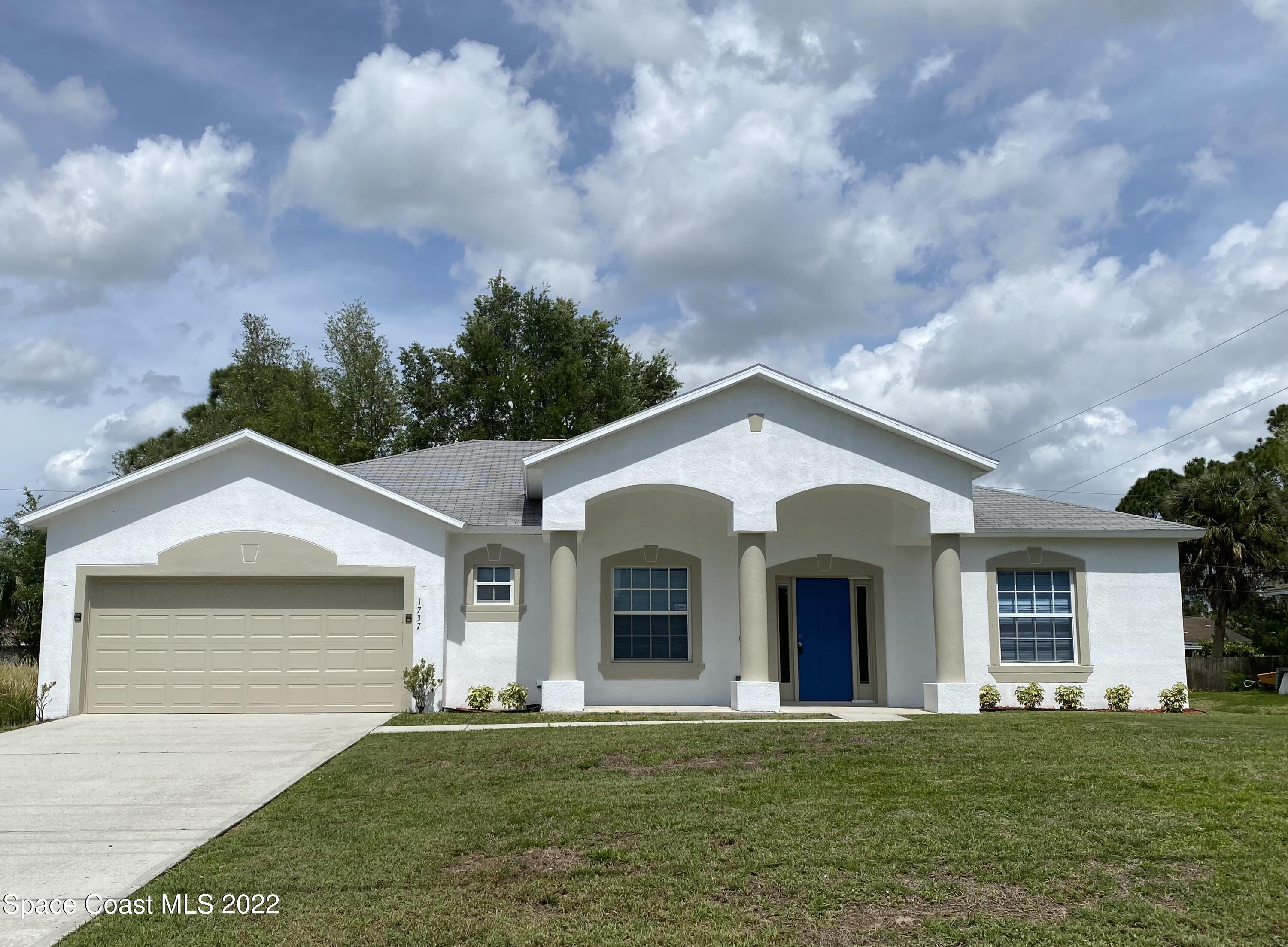 front view of a house with a yard