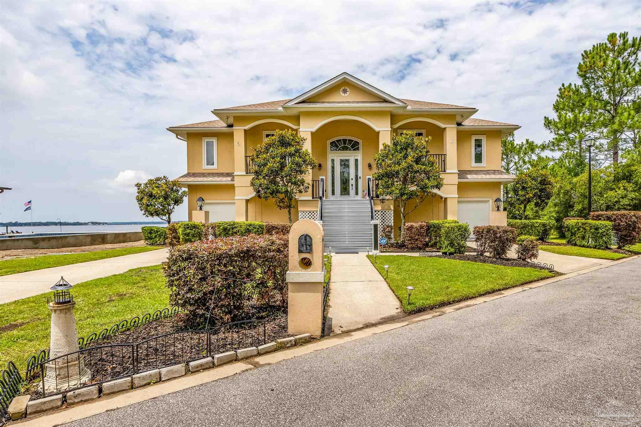 a front view of a house with a yard