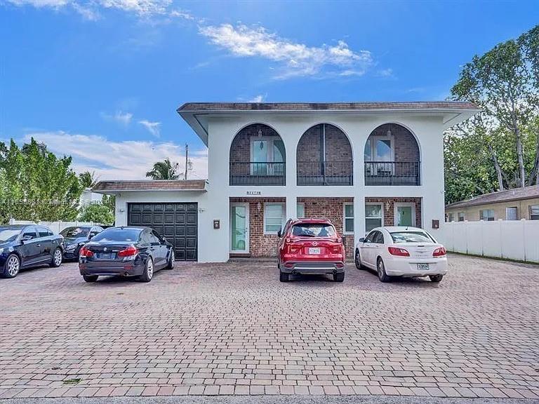 a car parked in front of a house