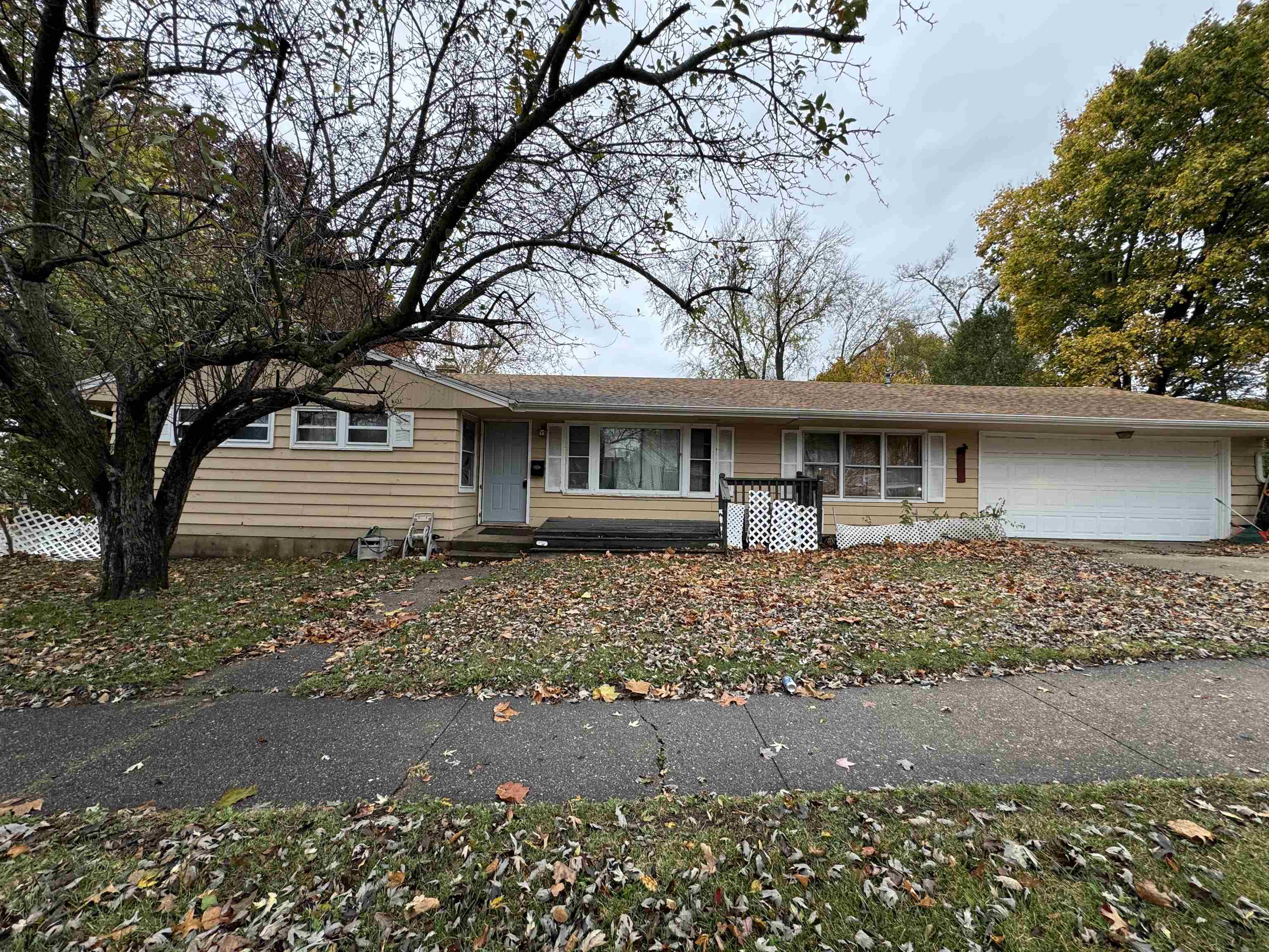 front view of a house with a garden