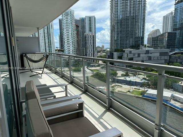 a view of a balcony with chairs