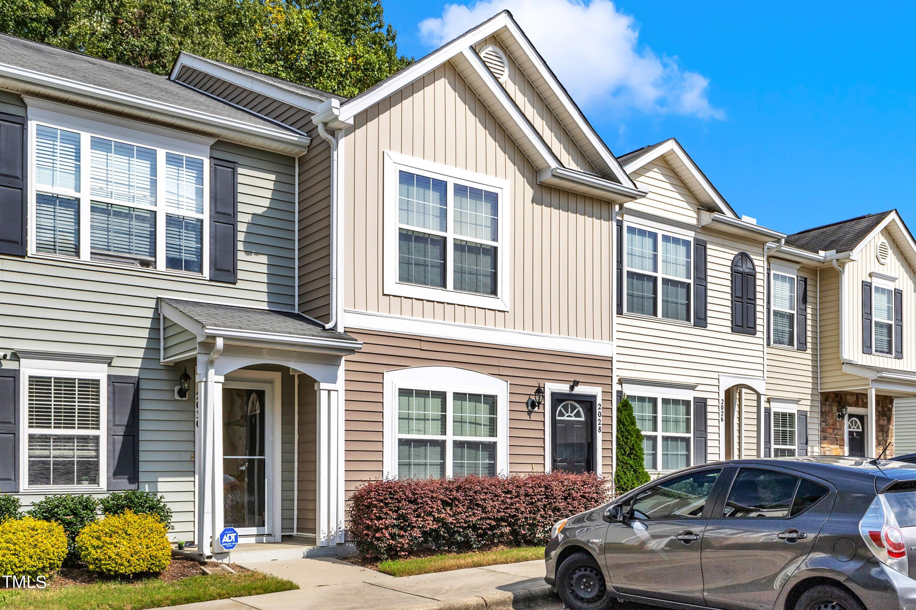 a front view of a house with parking