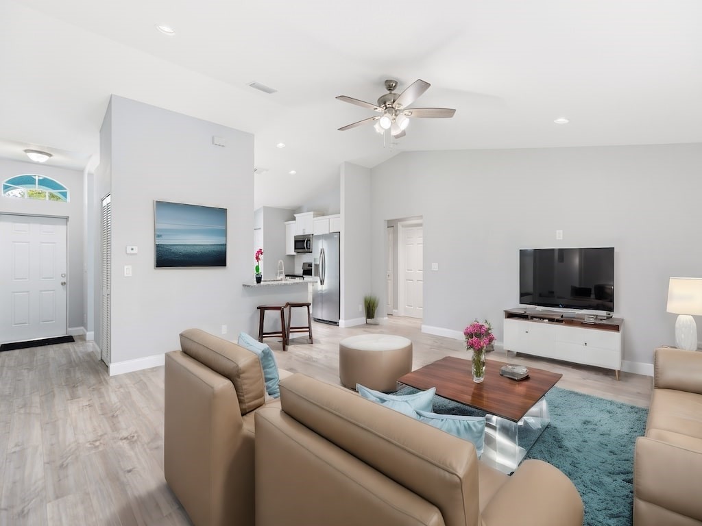 a living room with furniture and a flat screen tv