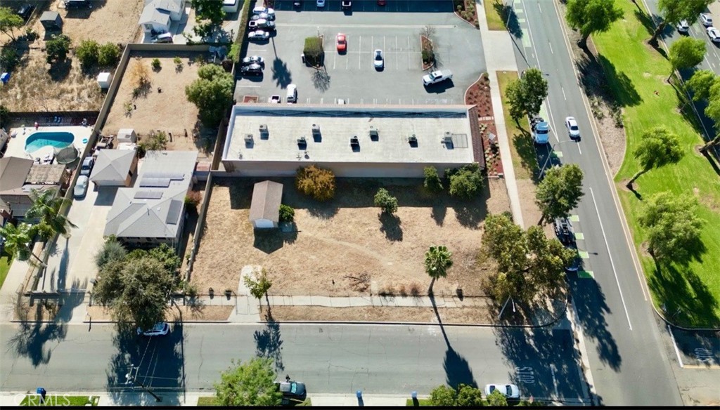 an aerial view of multi story residential apartment building with outdoor space