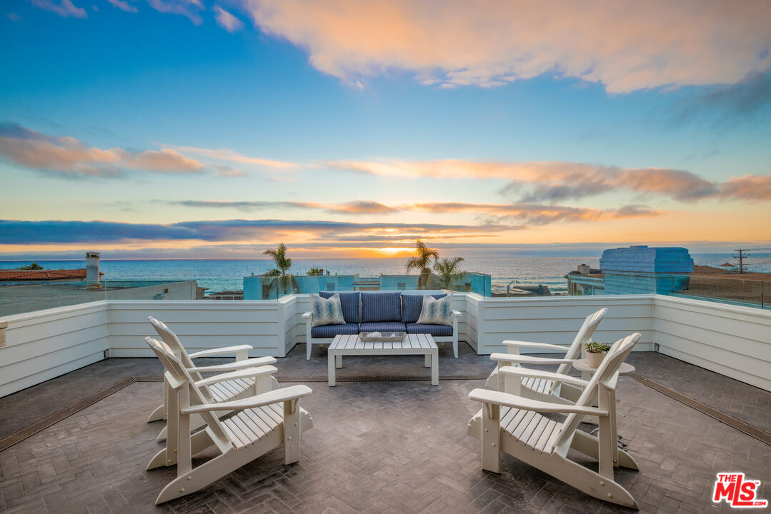 a view of a terrace with outdoor seating