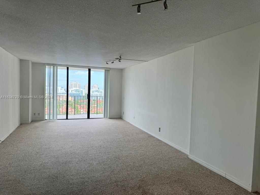 a view of an empty room with a window