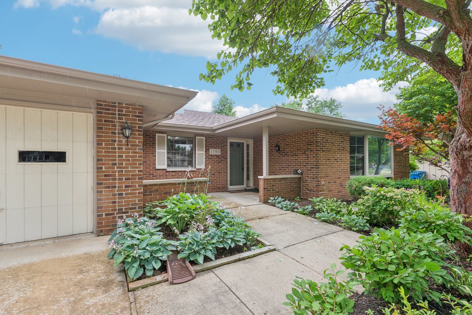 front view of a house with a yard