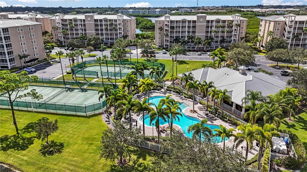 a view of yard with a large pool and lawn chairs