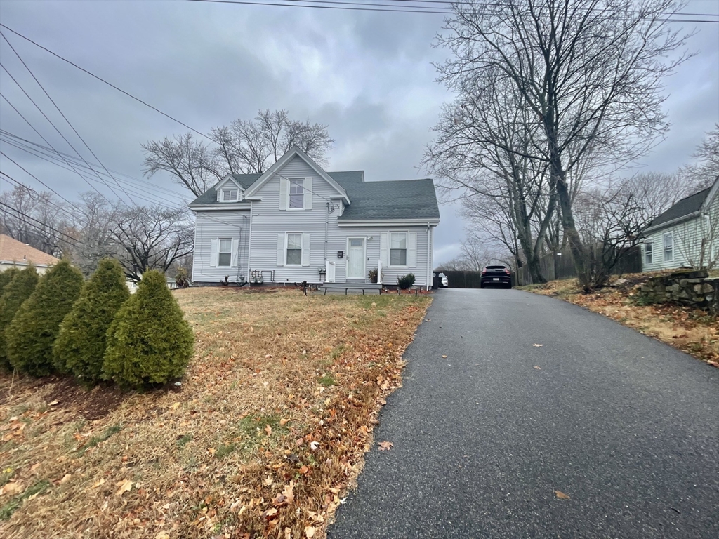 a view of a street with a house