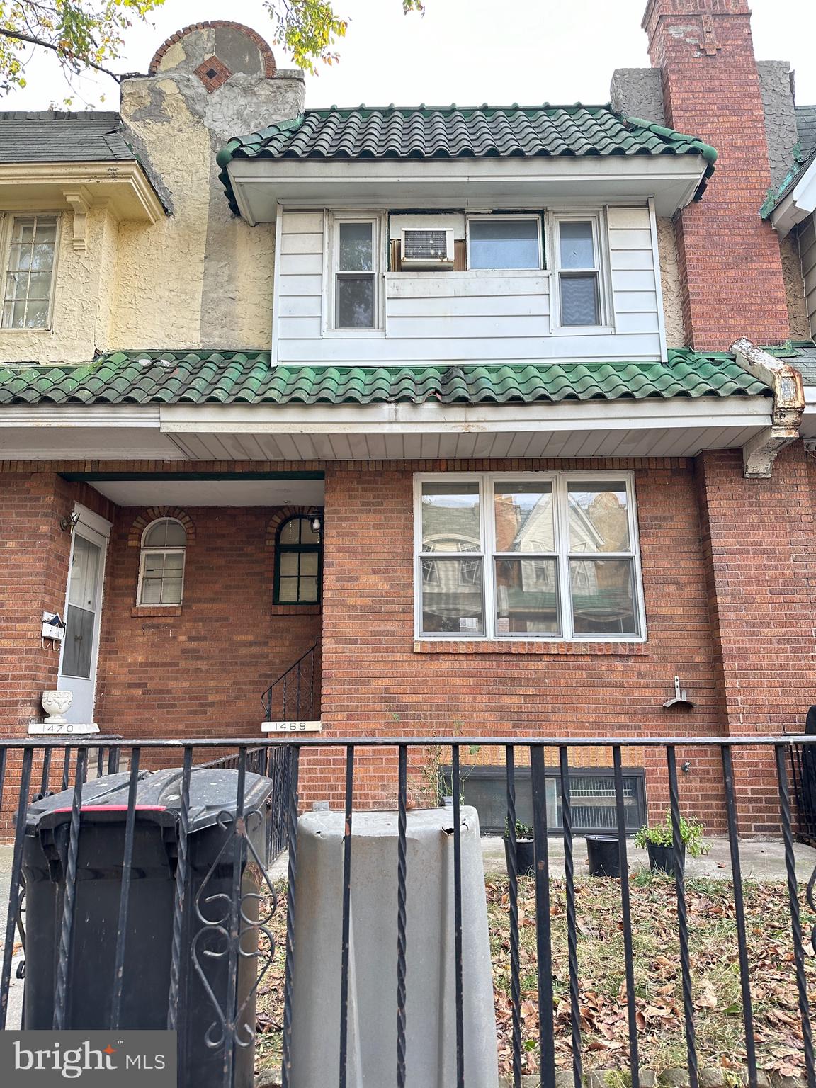 a front view of a house with garage