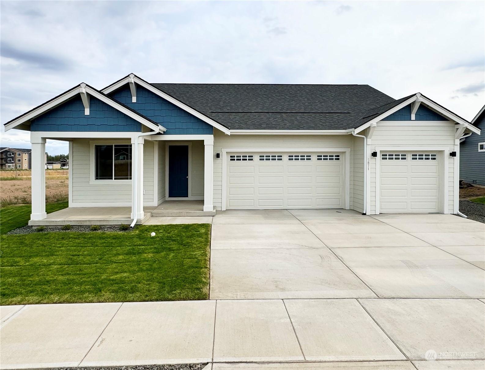 a front view of a house with a garage