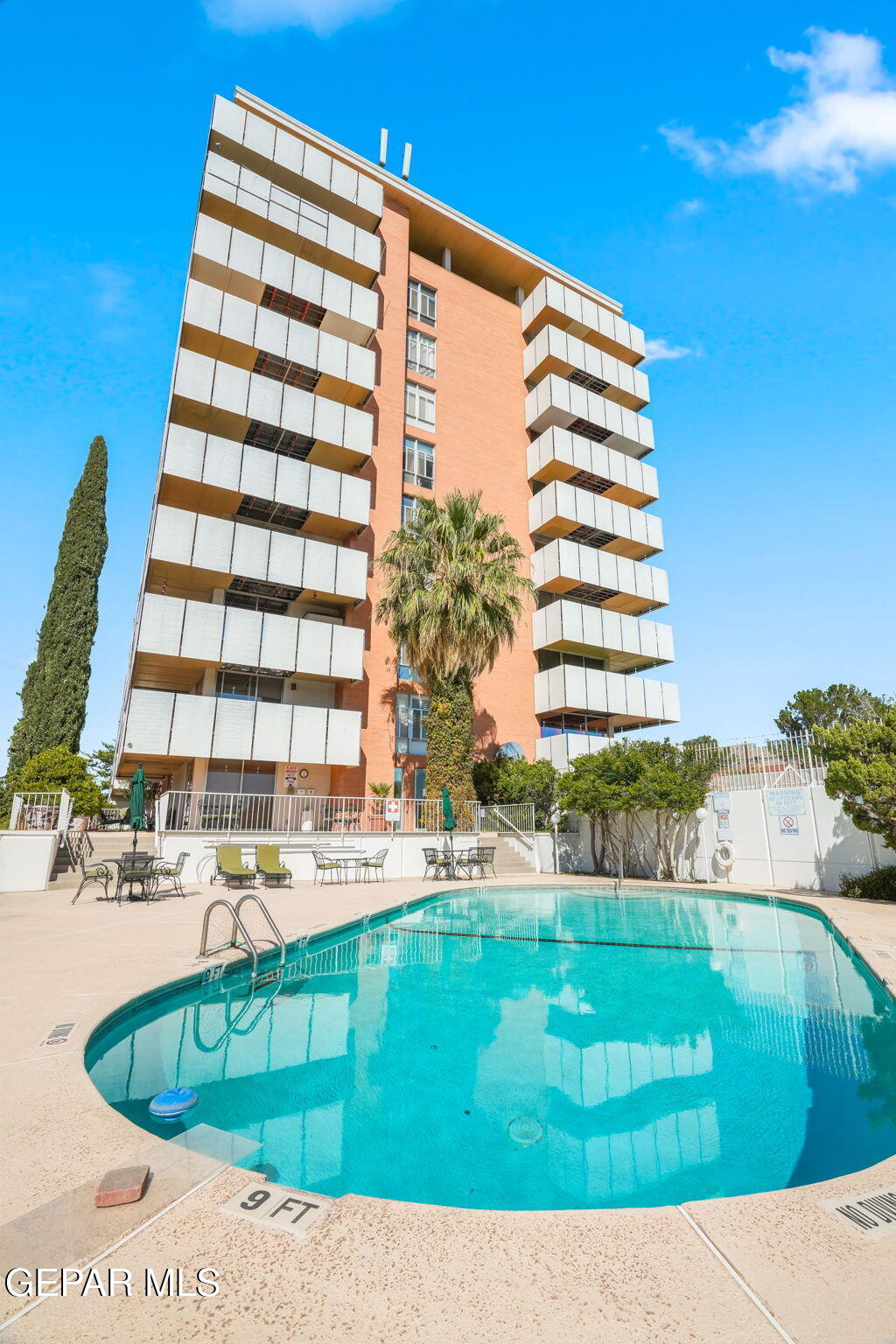 a view of swimming pool with a garden