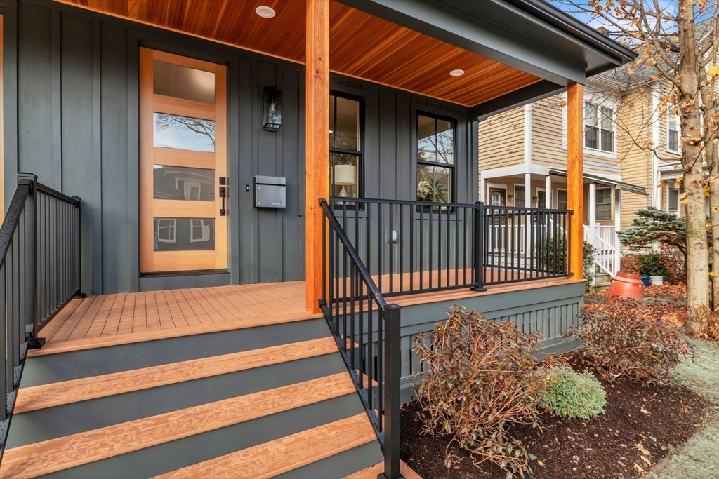 a view of front door of house with stairs