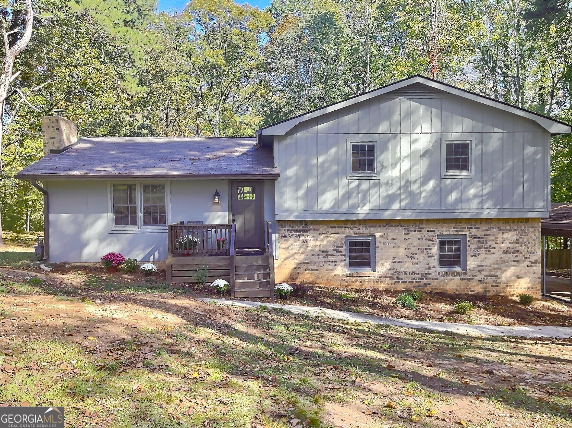 a front view of a house with garden