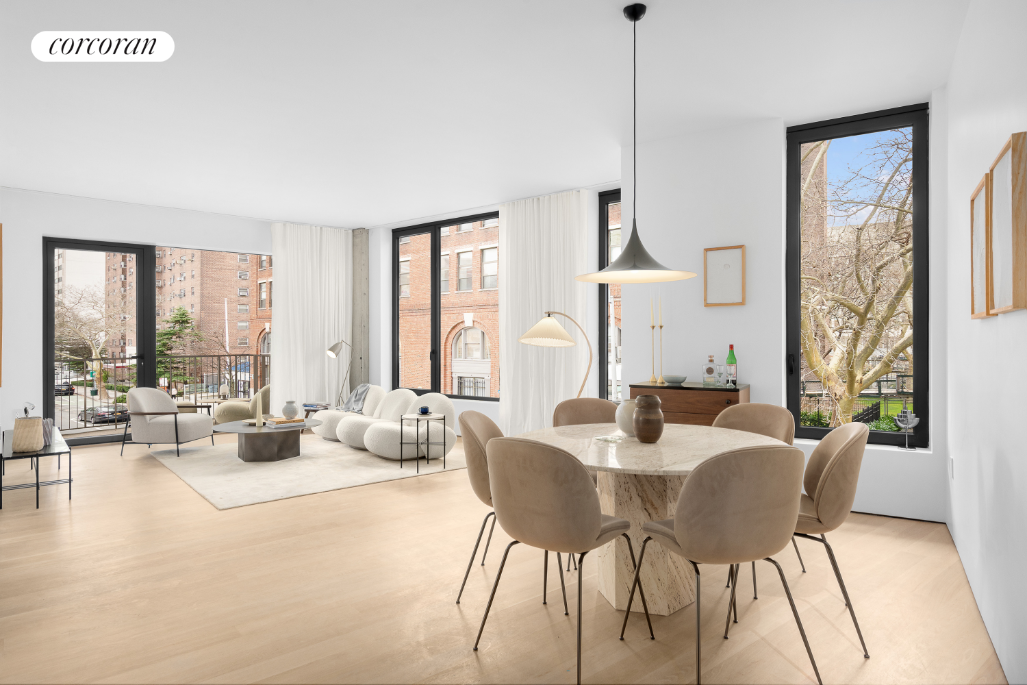 a view of a dining room with furniture window and wooden floor