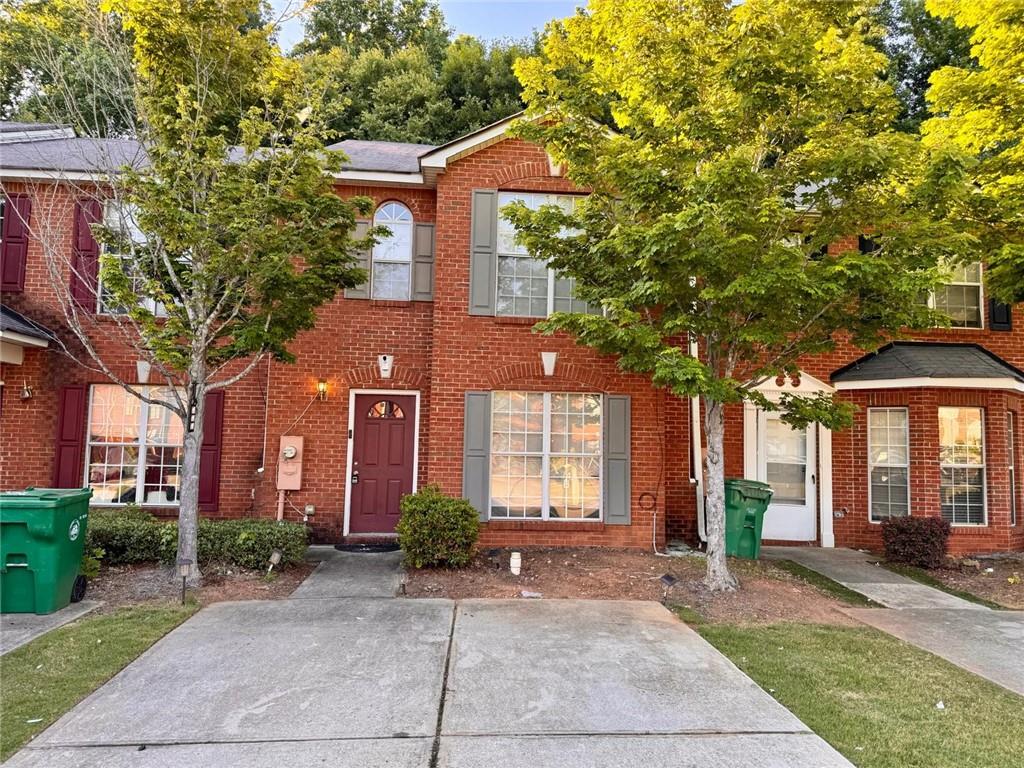 a front view of a house with yard