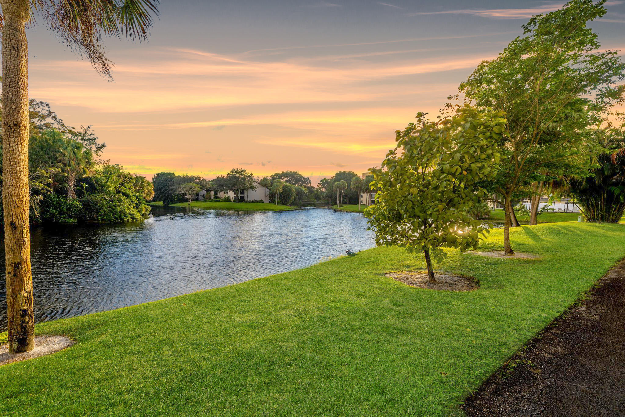 a lake view with a yard