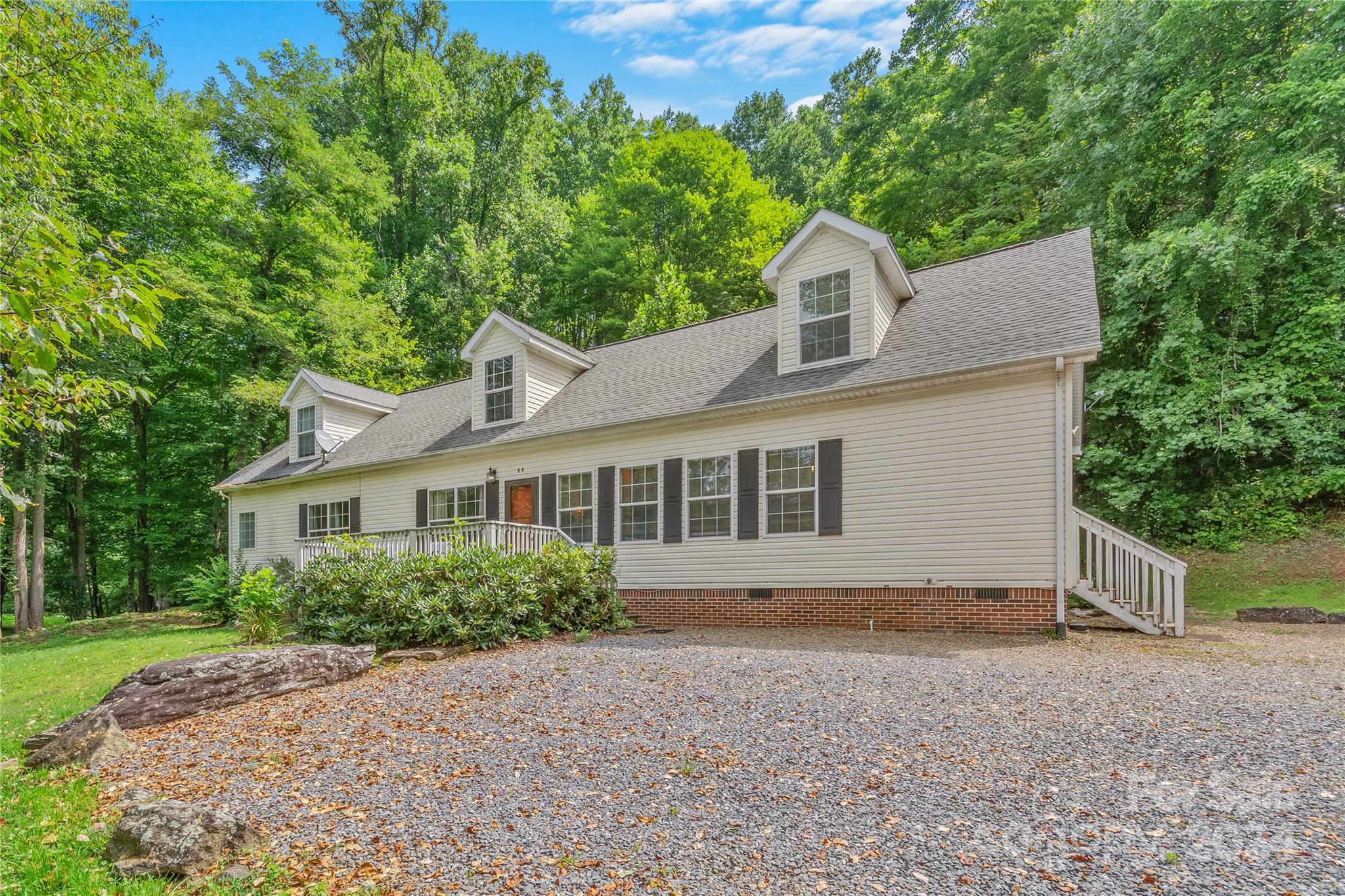 front view of a house with a yard