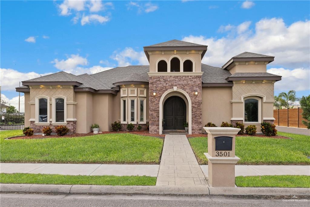 a front view of a house with a yard