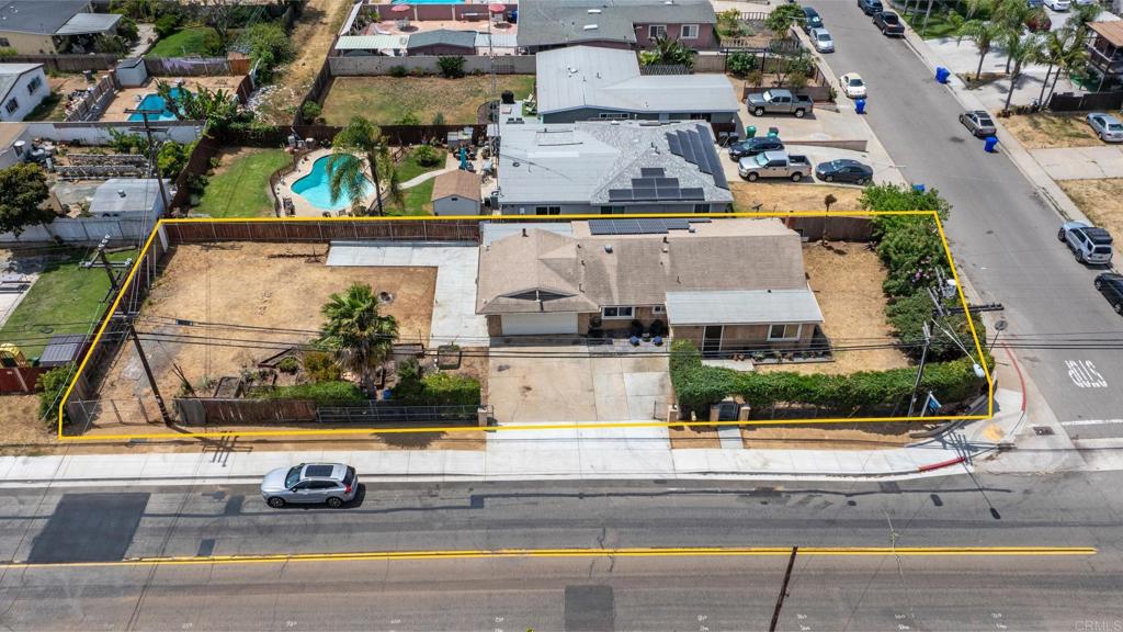 an aerial view of a building with a garden