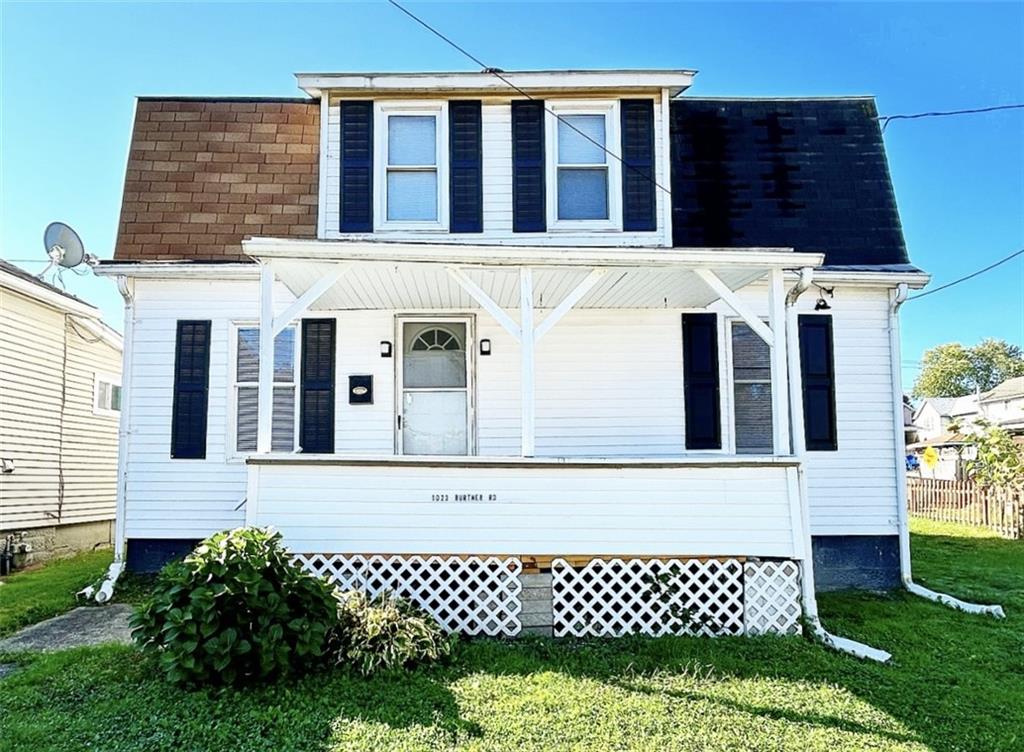 a view of a house with a large window