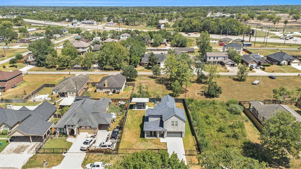 an aerial view of residential houses with outdoor space