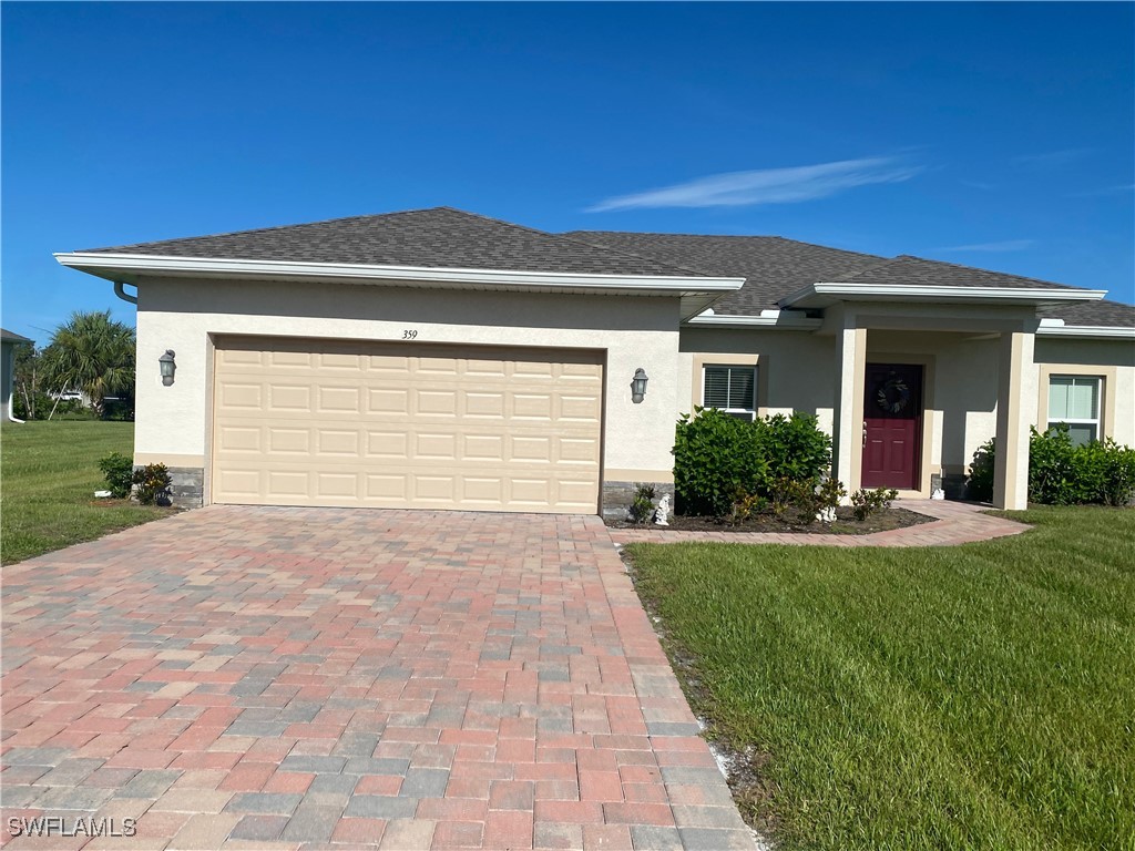 a view of a house with a yard