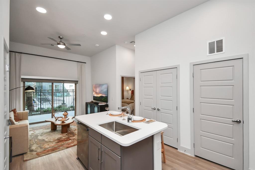 a kitchen with a sink and stove