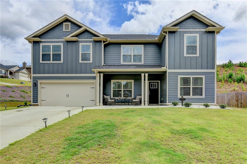 a front view of a house with a yard