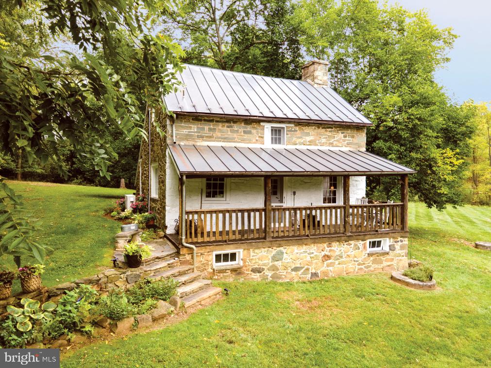 a view of a house with swimming pool and deck