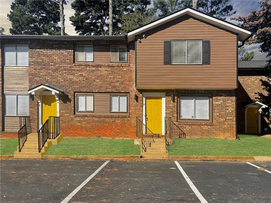 a front view of a house with a yard