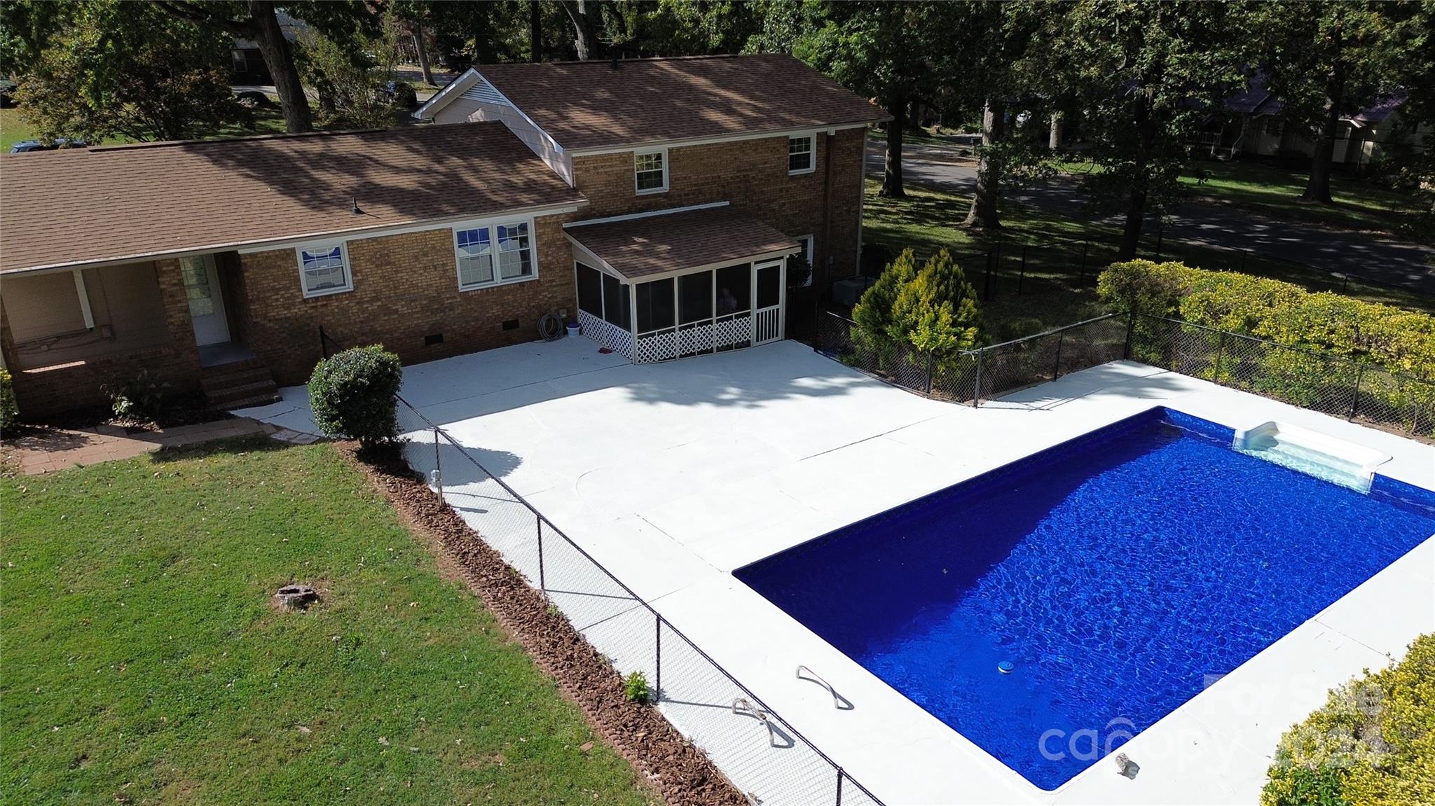 a view of a backyard with sitting area