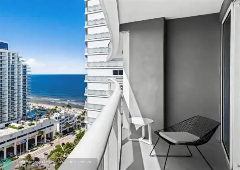 a view of balcony with furniture and rug