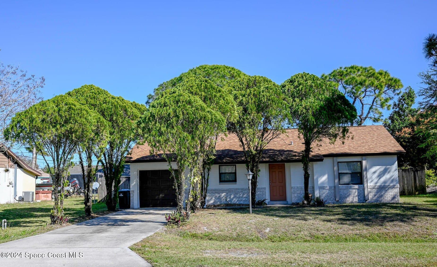 front view of a house with a yard