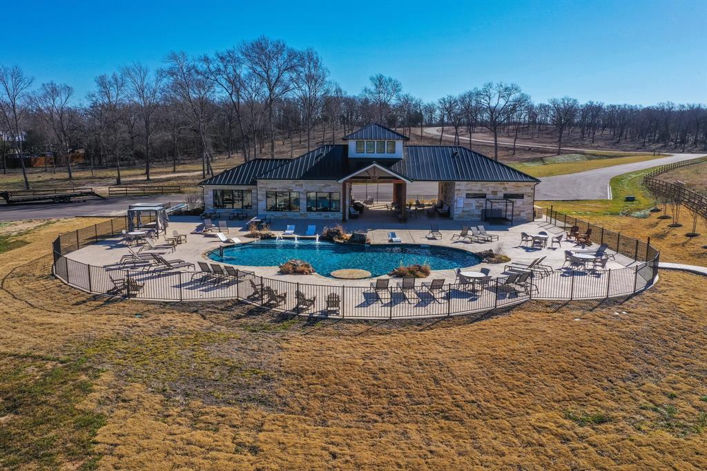 a view of a swimming pool with outdoor seating