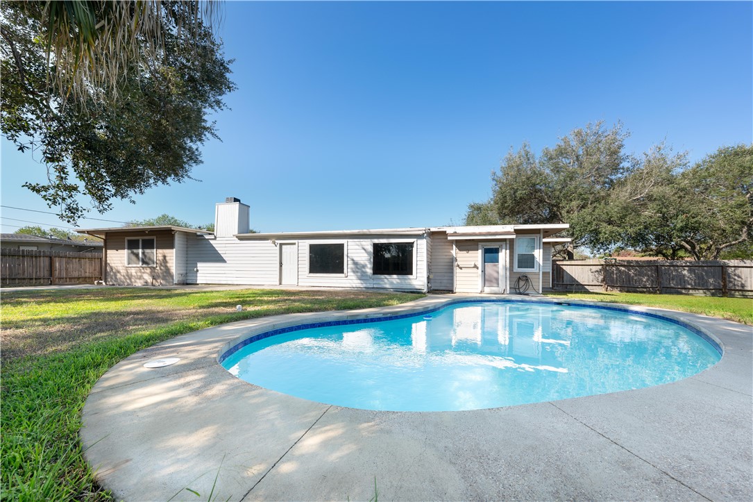 a view of a house with swimming pool