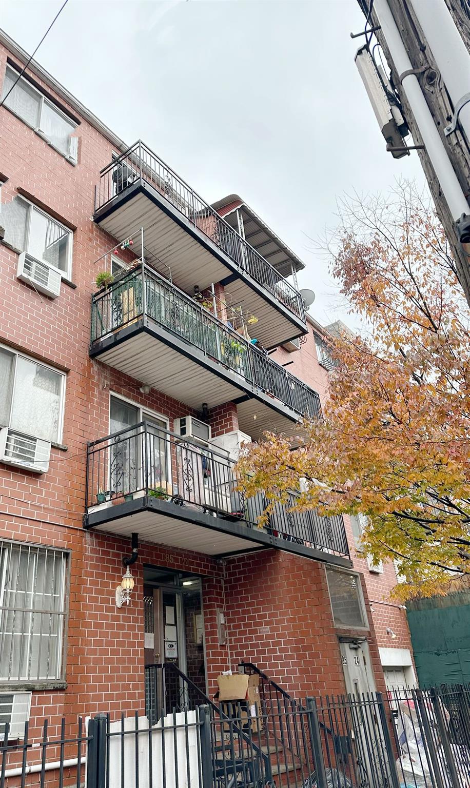 View of property with a wall mounted air conditioner