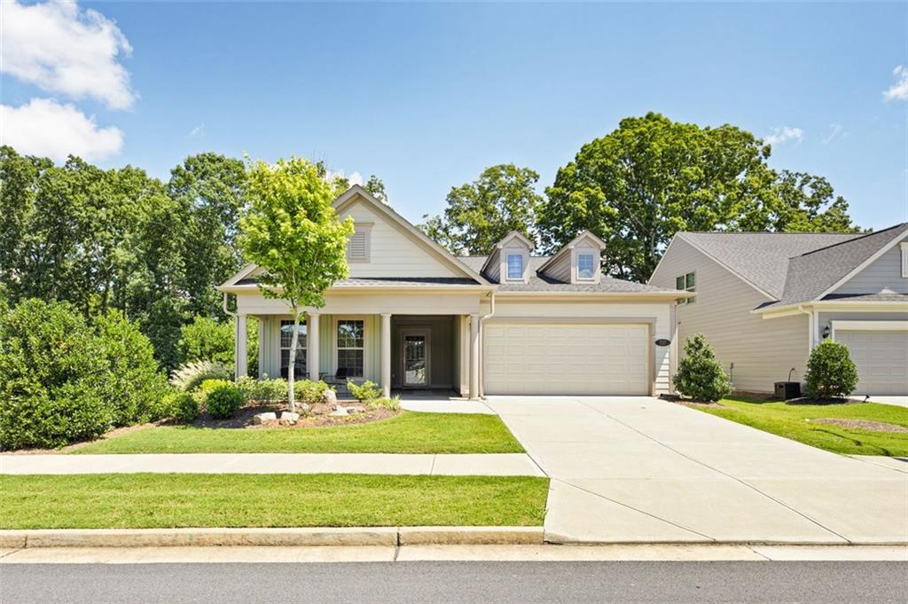 a front view of a house with garden