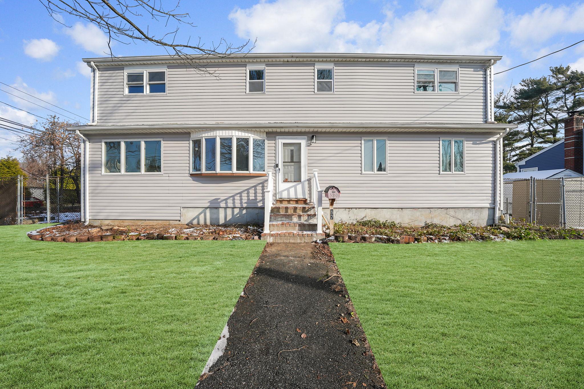 a front view of house with yard