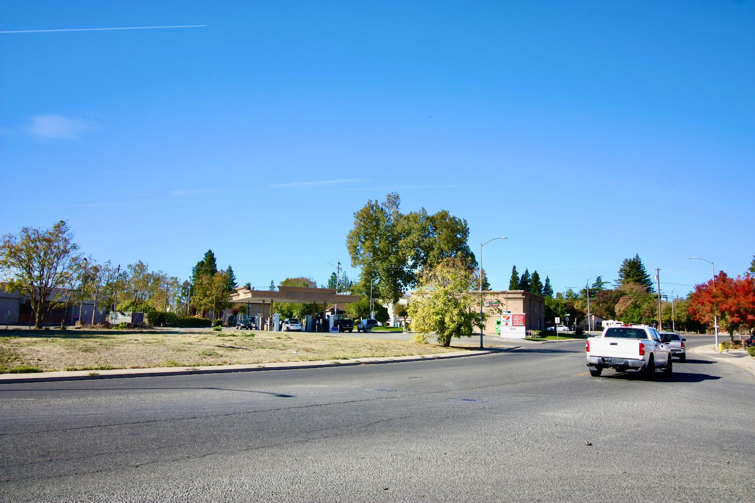 a view of car parked on the side of a street