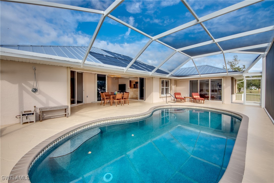 a view of a swimming pool with a patio