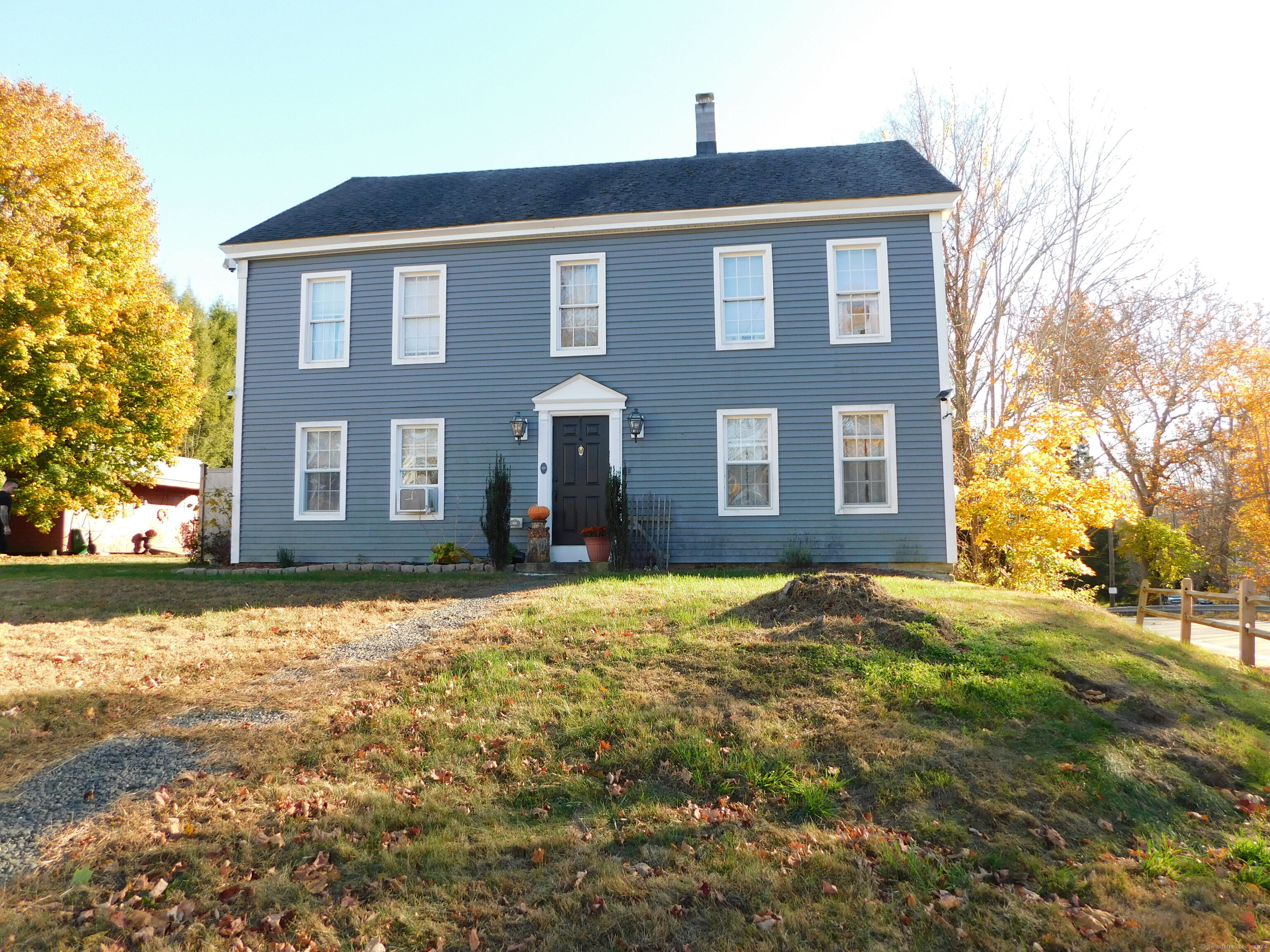 a front view of a house with a yard