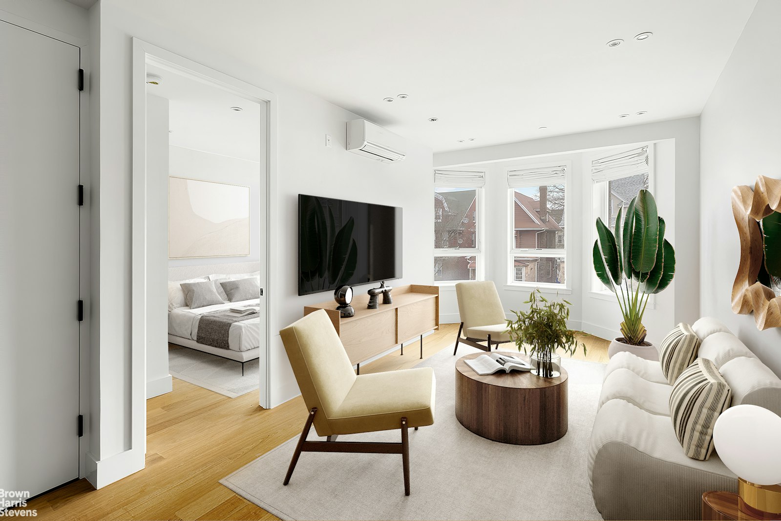 a living room with furniture and a flat screen tv