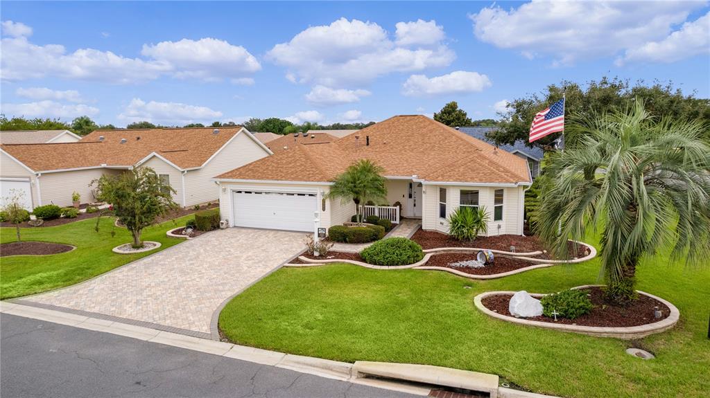 a aerial view of a house with swimming pool and garden