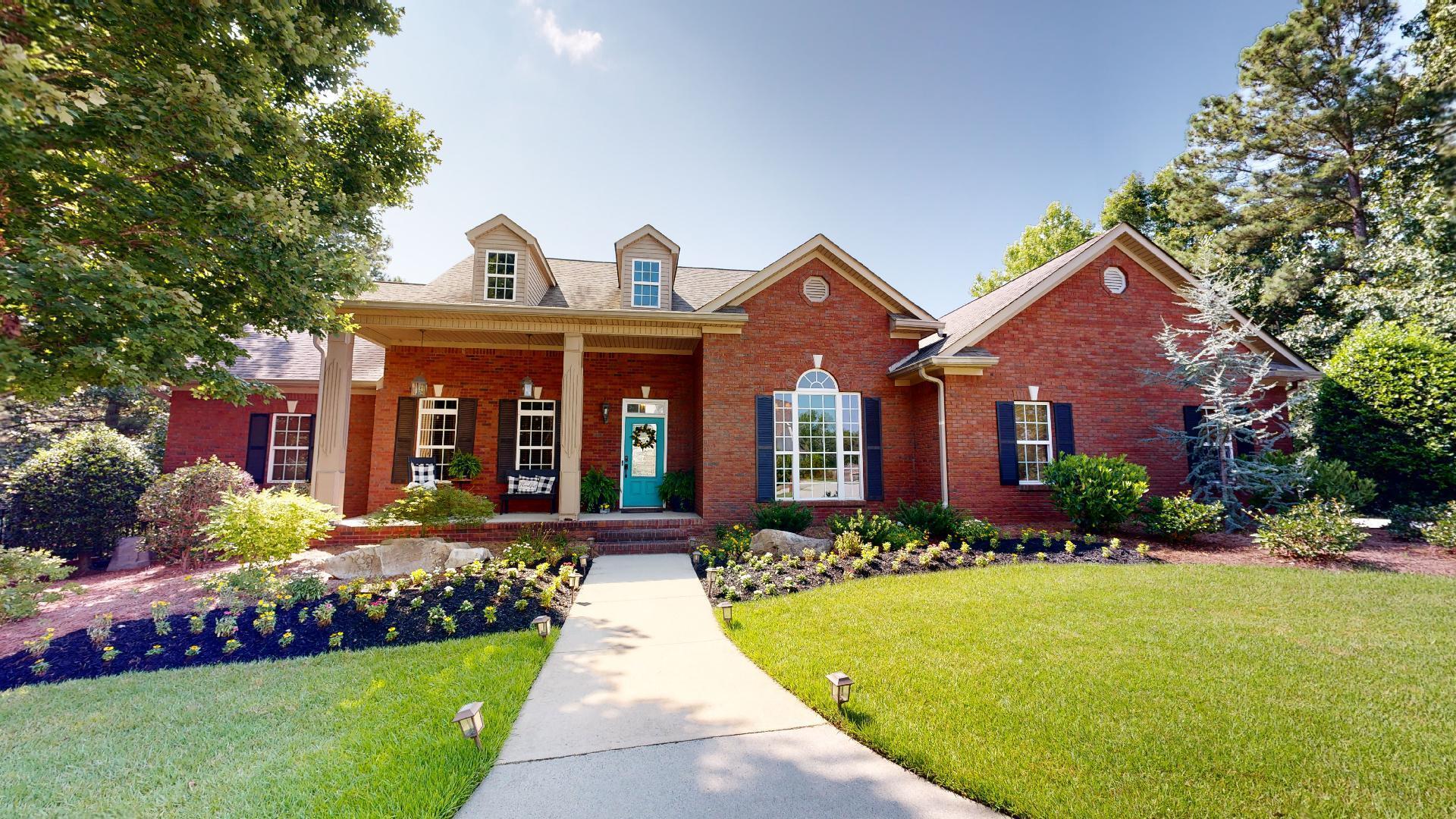 a front view of a house with a yard