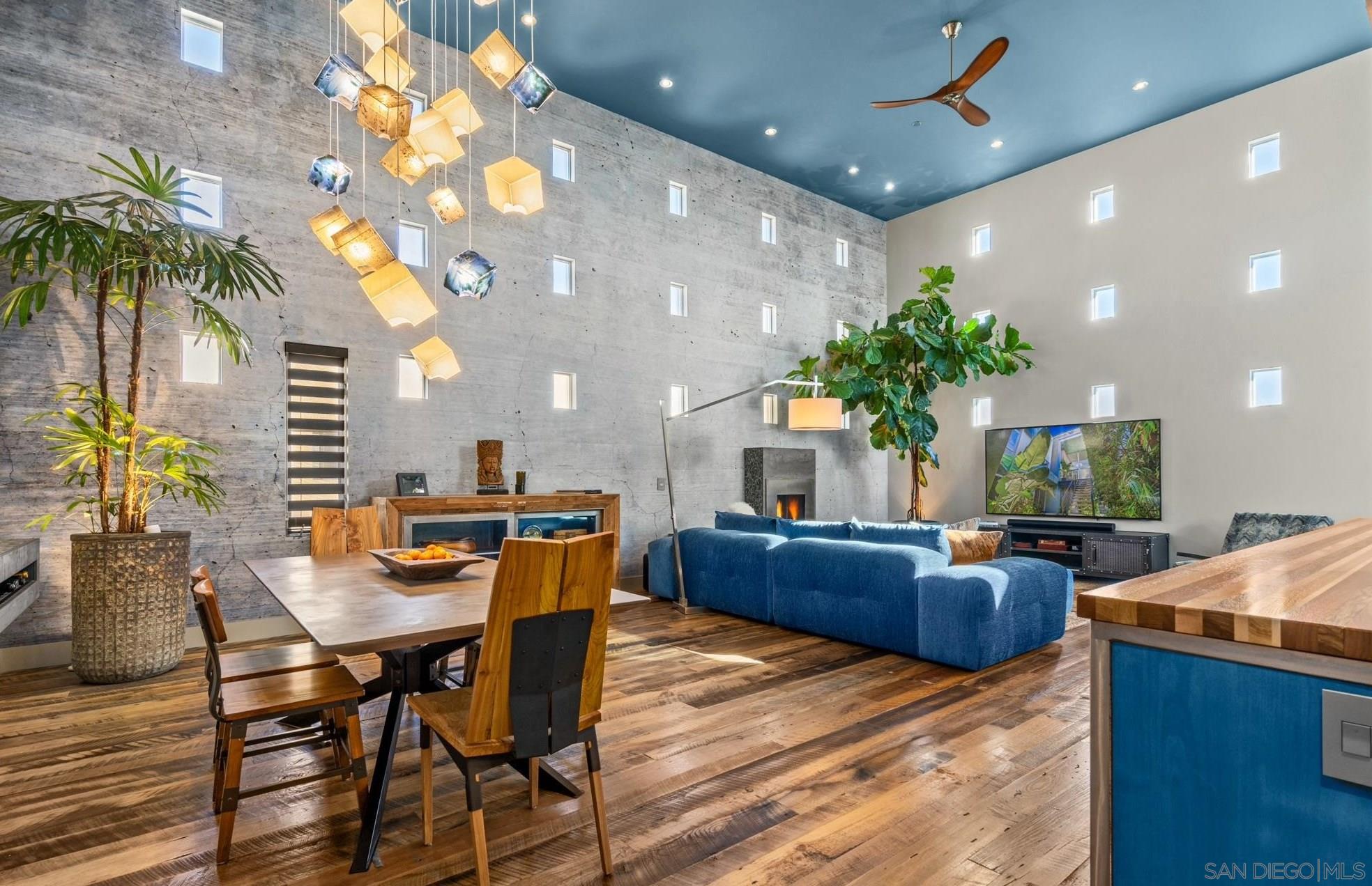 a living room with furniture and a kitchen