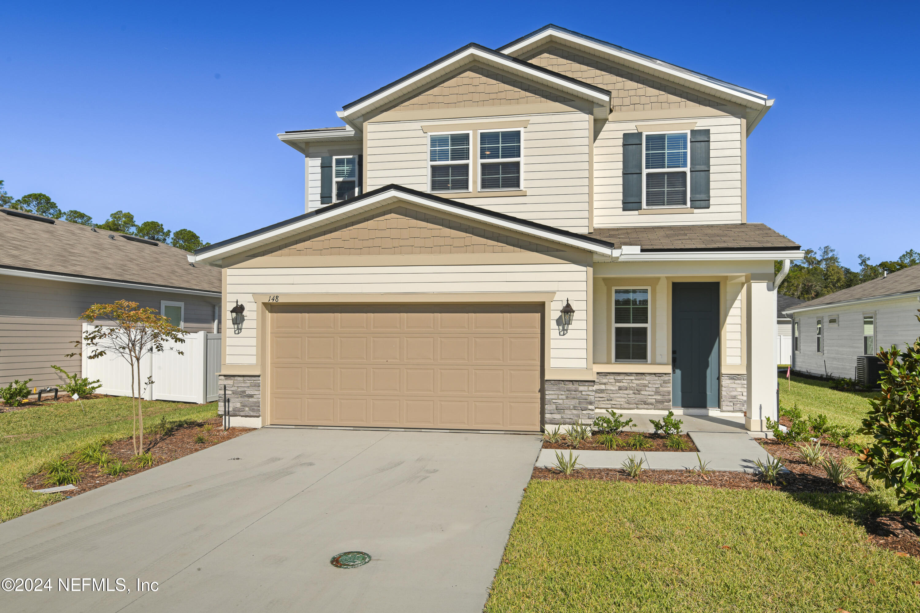 front view of a house with a yard