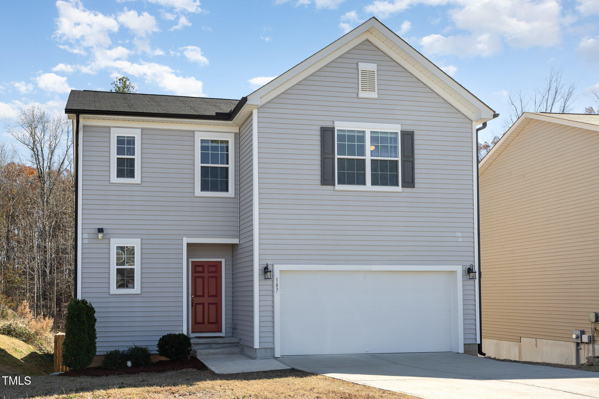 a front view of a house with garage