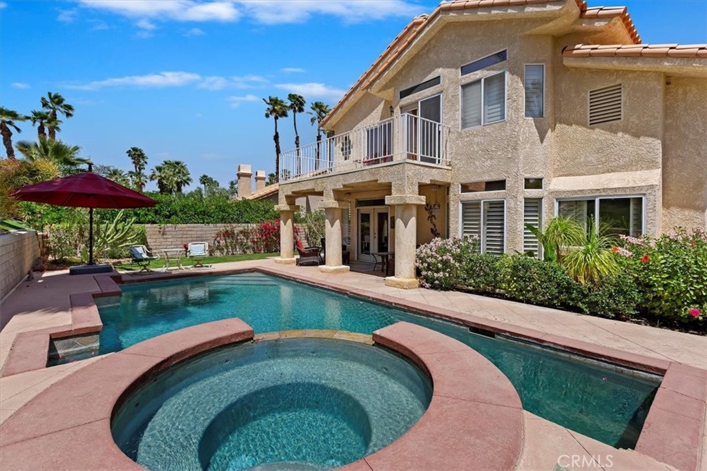 a swimming pool with outdoor seating