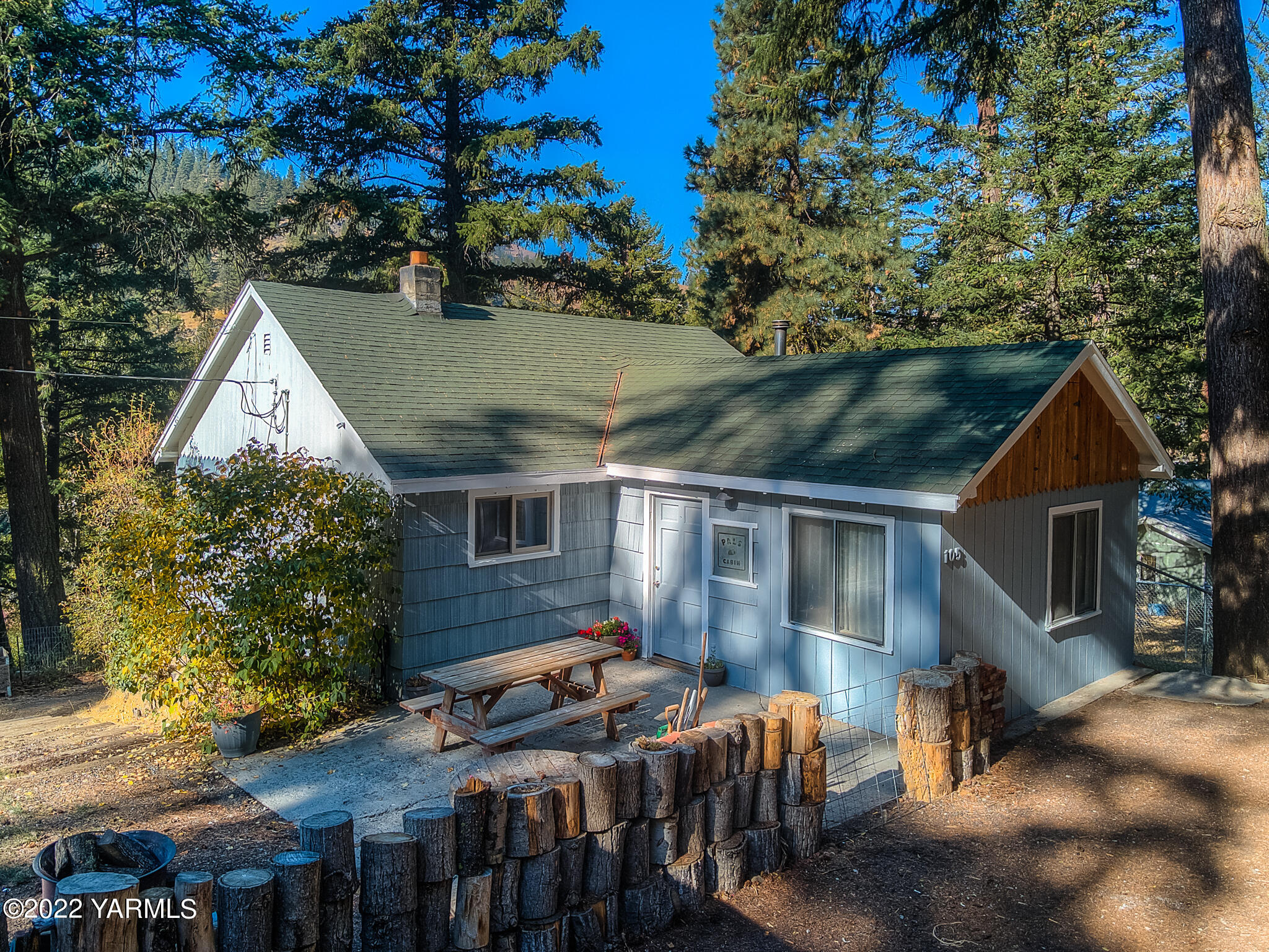 a view of house with a yard